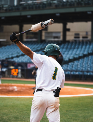 Baseball player with his bat in the air