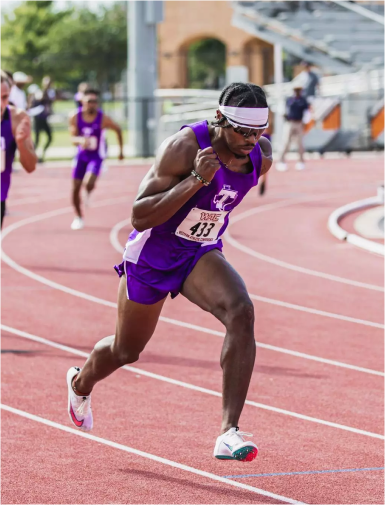 University athlete running on a track